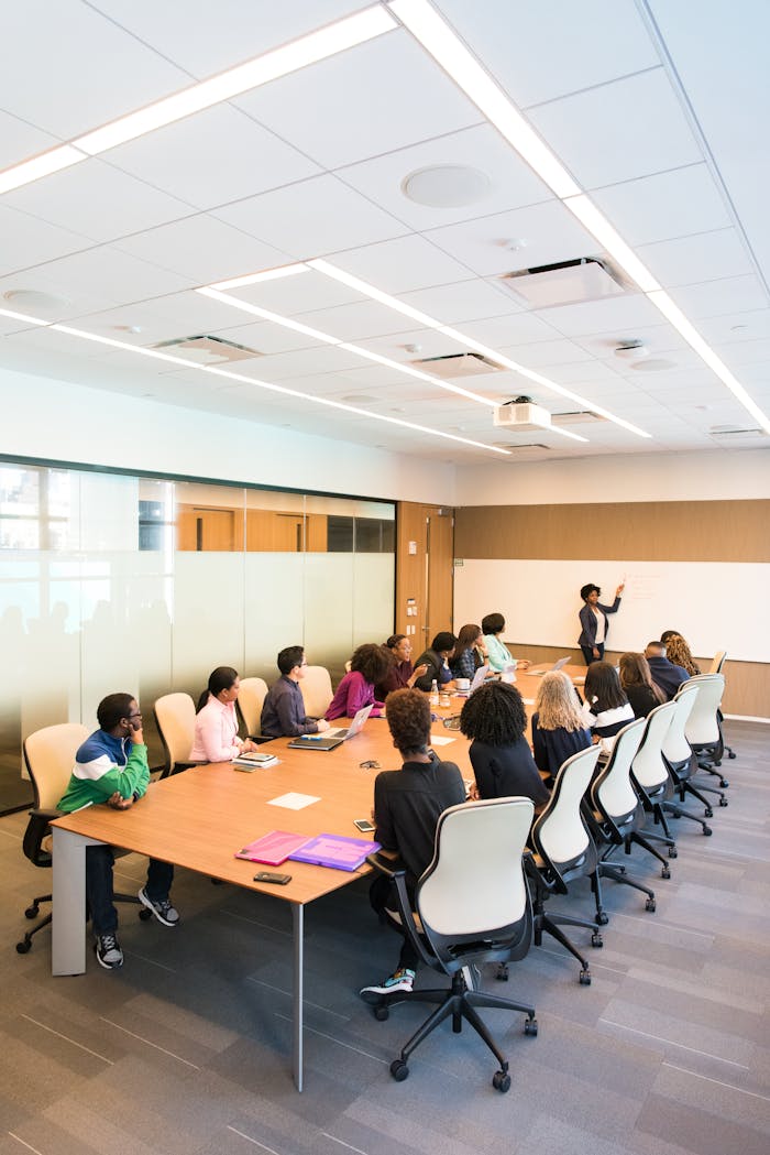digital Professional team engaged in a collaborative boardroom meeting with a presentation in progress.