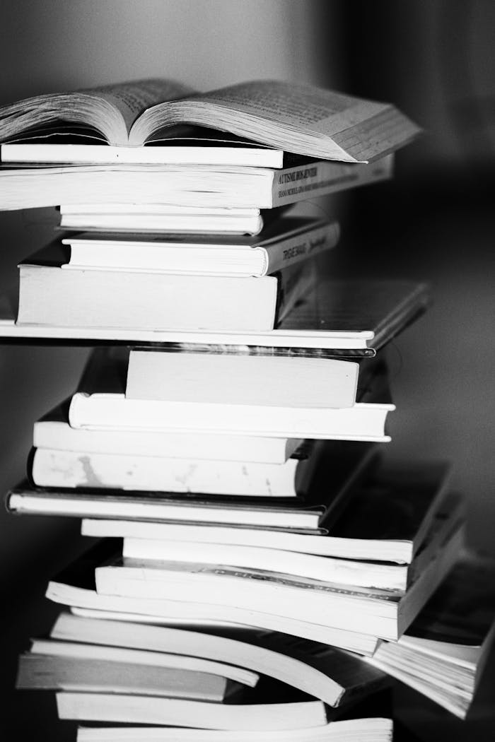 creative A monochrome image of a tall stack of books symbolizing education and knowledge.
